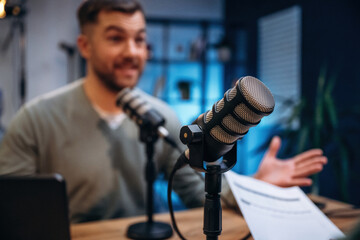 Man with microphone in the studio, conception of podcast