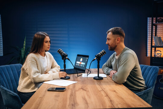Having a conversation. Radio hosts recording podcast - Powered by Adobe