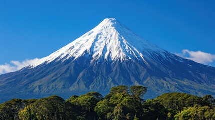 A mountain peak beneath a stunning, clear blue sky.