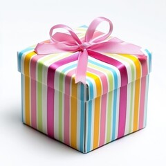 Obraz premium Festive striped gift box with pink ribbon on white background for birthday celebration or special occasion