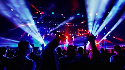 Exciting concert with vibrant light show at downtown venue, showcasing talented performers and enthusiastic crowd