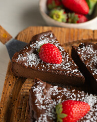 Delicious sweet cheesecake with chocolate and fresh strawberries.