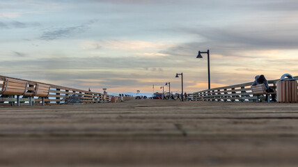 A pier at sunset on a california beach