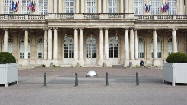 The Governor's Palace in Nancy, France, showcases classical architecture with grand columns and statues, surrounded by lush greenery and a serene courtyard.