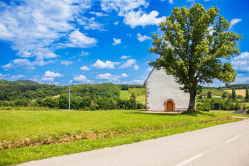 Obraz premium The Church of St. Andrew in Kamešnica, dating back to the 14th century, has preserved its original Gothic appearance with a steep double-pitched roof.