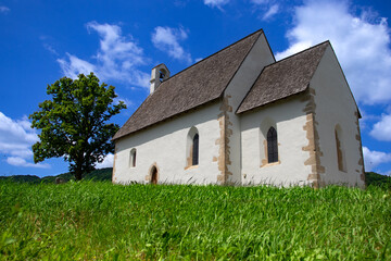 The Church of St. Andrew in Kamešnica, dating back to the 14th century, has preserved its original Gothic appearance with a steep double-pitched roof.