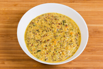Porridge of black, red and white quinoa seeds in bowl