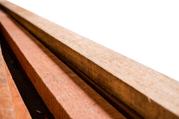 Close-up of a wooden beam pile isolated