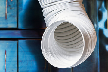 Flexible air duct ventilation hose in an industrial space