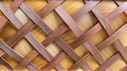 Woven from natural materials, handicrafts, woven crosswise into a square shape, woven background.