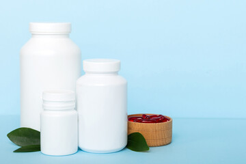 different drugs and health supplement pills with medicine bottle health care and medical top view. Vitamin tablets. Bottle with colored pills on table background. Multivitamins