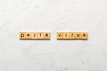 delta virus word written on wood block. delta virus text on table, concept