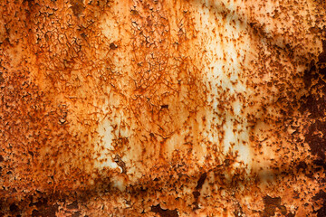 White metal surface with bright smudges of rust background