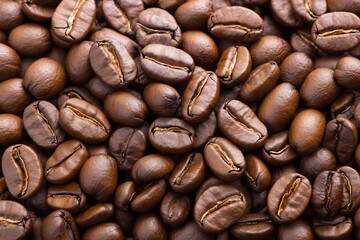 Fototapeta premium Roasted coffee beans background. Close-up texture for drink, food themes