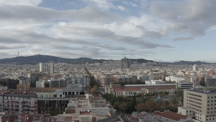 Obraz premium Bird's-eye view of residential areas, roads and sights of Barcelona, drone video