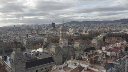 Bird's-eye view of residential areas, roads and sights of Barcelona, drone video