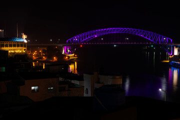 night view with the illuminated bridge and building