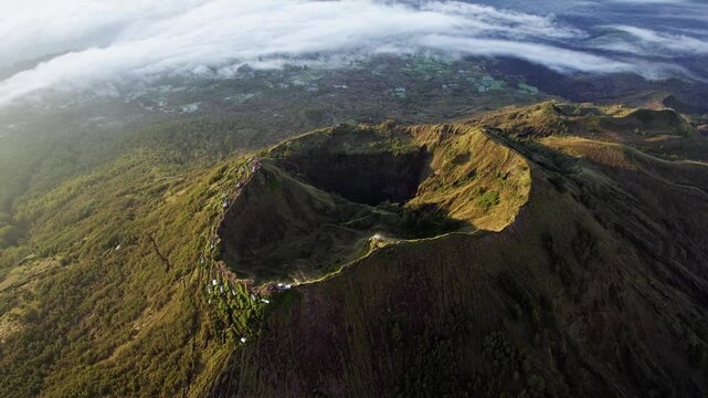 Mount Batur slow high aerial orbit at dawn, Bali