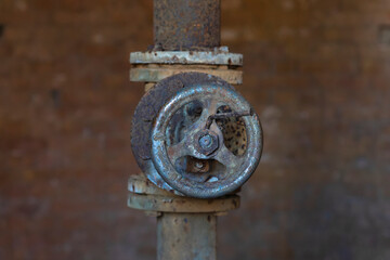 Old metal tap for water supply.