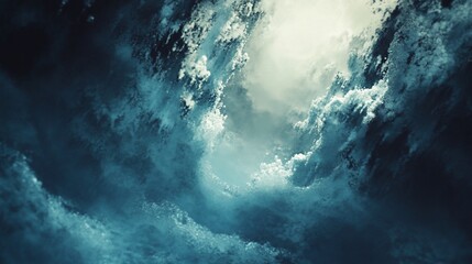 Dramatic dark cloudscape with light breaking through.