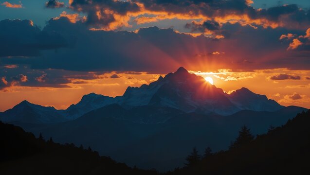 Mountain landscape at sunset with dramatic clouds and sun rays illuminating peaks in the background