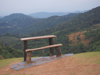 Wooden vintage bench and table on the mountain.
