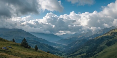 Fototapeta premium Mountain valley landscape with dramatic clouds and rolling hills under a blue sky. Natural scenery in a remote setting.