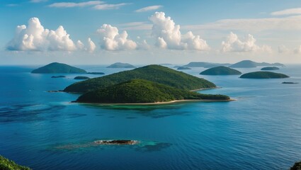 tropical island seascape with multiple green hills and blue ocean under a partly cloudy sky during daytime