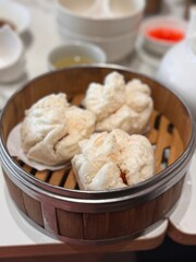 chinese steamed bun in bamboo basket, dimsum