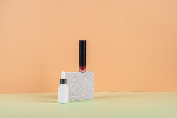 Mockup of black blank thin tube - mascara, lip gloss, gel, eyeliner, oil, etc. Cosmetic package with stylish props on cream background.