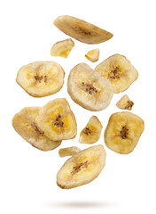 Dried banana chips and pieces flying on a white background. Isolated