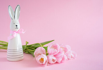 Easter Card with Bunny and Tulips on Pink Background with Copy Space. High quality photo
