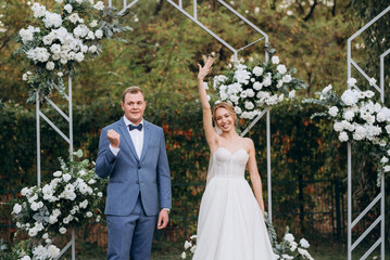 wedding ceremony of the newlyweds on the glade