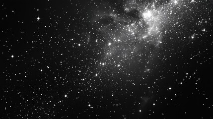 Fototapeta premium Whispering cosmos in monochrome; countless stars twinkle against an endless, ink-black expanse—a celestial dance captured in ethereal silence