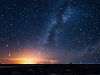 Starry Night Sky Over Silhouetted Landscape