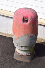 red hydrant losing the paint