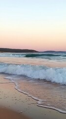 Obraz premium Serene Coastal Sunset: Pastel Hues on the Beach