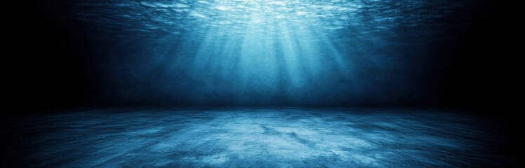 A serene underwater scene illuminated by soft rays of light, creating a tranquil and immersive blue atmosphere.