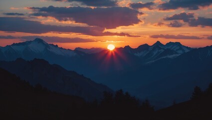 Obraz premium Majestic sunset over mountain ranges with silhouetted peaks and a colorful sky, creating a serene and tranquil nature landscape.
