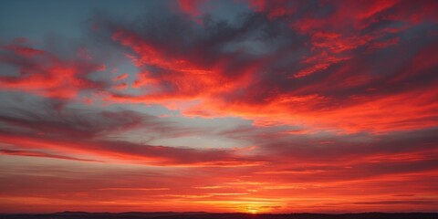Vibrant Orange Red Sunset Sky With Dramatic Cloud Patterns And Blank Space For Text Or Graphics In Horizontal Orientation