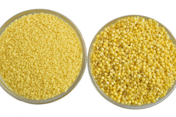 Couscous and millet groats in glass bowls isolated on white background.