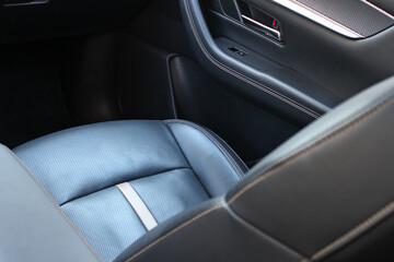 Obraz premium Stitching and decoration of different types of leather trim for seats in car interiors. Car seats inside premium car. Vehicle interior upholstery 