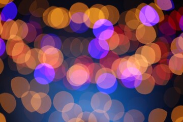 Blurred view of colorful lights on dark blue background, bokeh effect