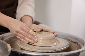 Hobby and craft. Woman making pottery indoors, closeup