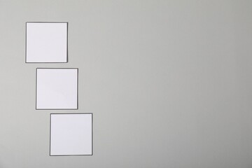 Empty checkboxes on grey background, flat lay. Space for text