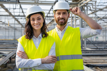 Two colleagues engineers looking confident while working together