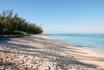 Idyllic beach close to Le Morne Brabant mountain, showcasing pristine sands and clear blue waters in Mauritius