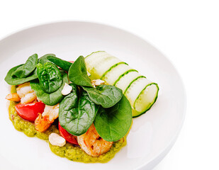 Delicious shrimp dish served with fresh vegetables on white plate
