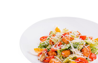 Fresh salad with vegetables and toppings on a white plate