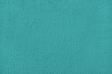 Old plaster surface, texture stucco background, close up grunge texture of turquoise painted cement, concrete wall texture. Wallpaper, backdrop, architecture design element